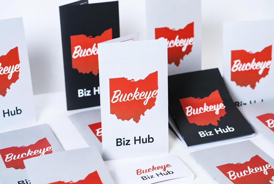 Folded brochures, booklets and cards printed with a red Ohio-shaped Buckeye logo