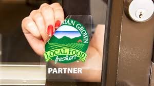 Custom window cling static decal on a storefront glass door