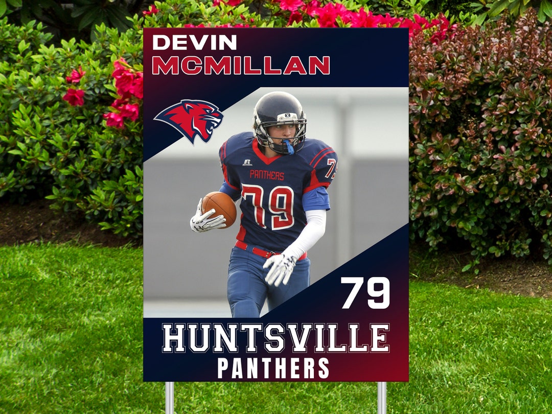 Sample football player yard sign with a photo, name, jersey number and team name, standing in a front yard