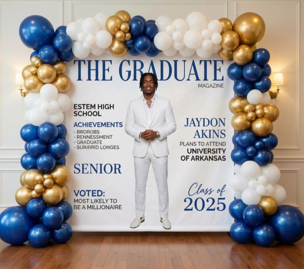 Magazine-style graduation backdrop with balloon arch