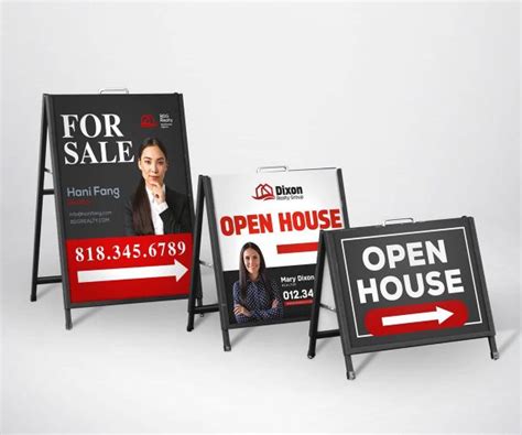 Three black A-frame sidewalk signs with printed for sale and open house panels