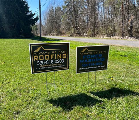 Lawn care yard signs staked in residential lawn